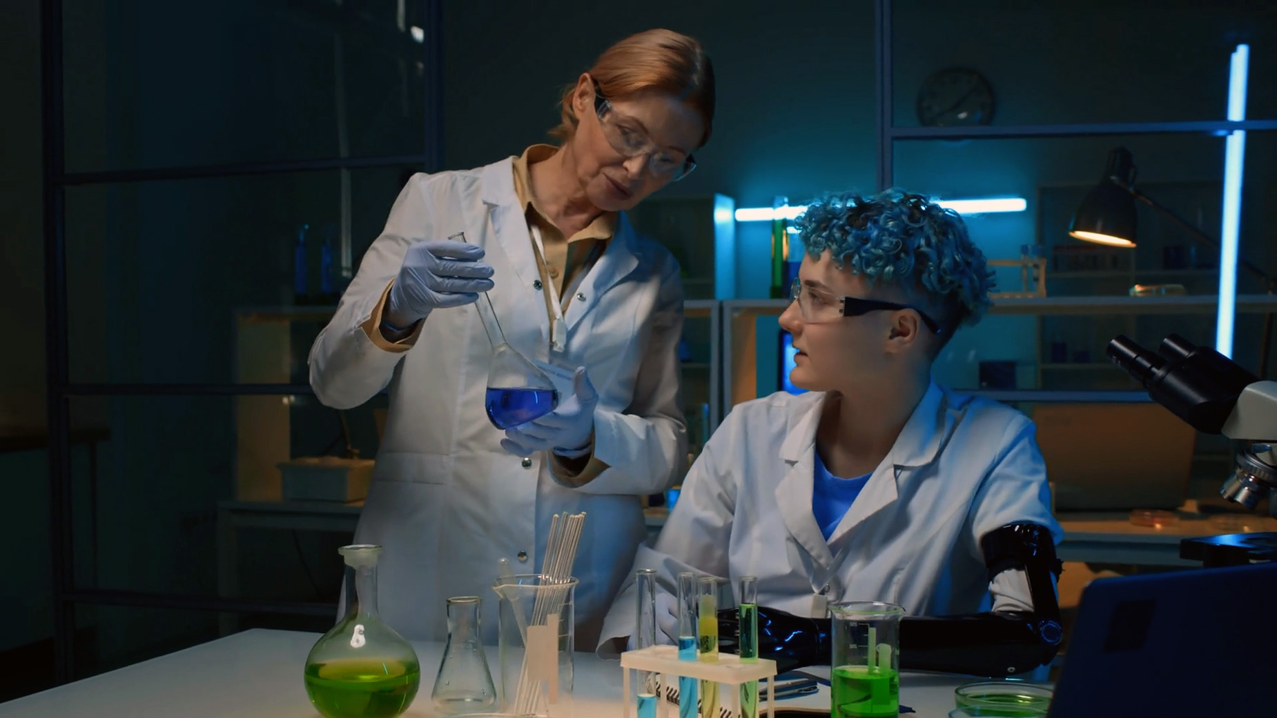 AP Chemistry Online Course - Student learning from instructor in chemistry lab setting.